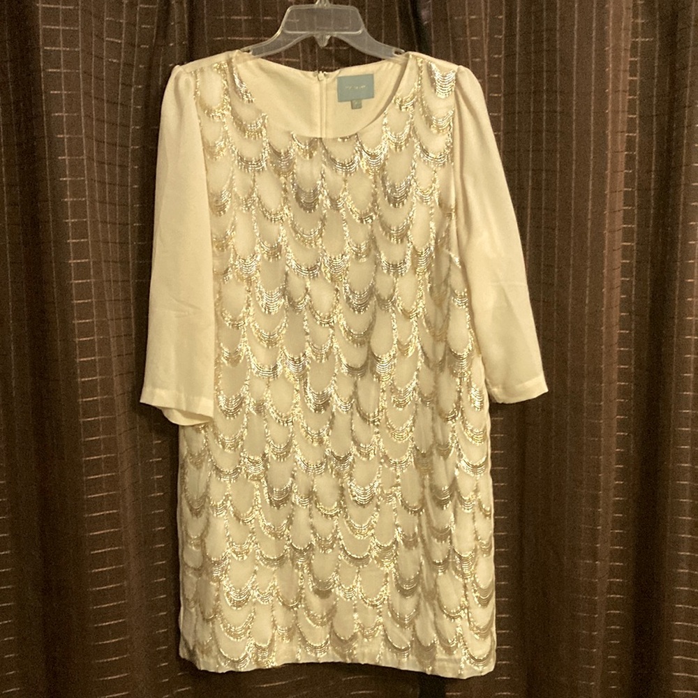 Off white shift dress. Beautiful silver and gold stitched detail. 3/4 sleeves.